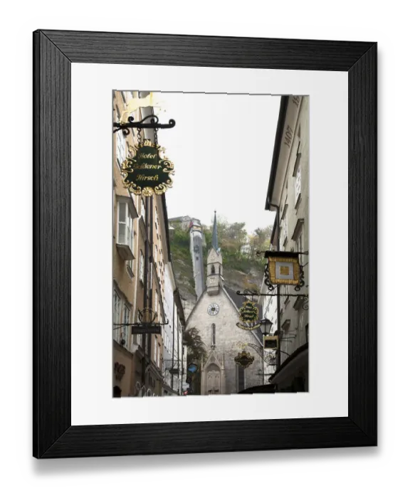 Framed Print : Salzburg, Salzburg, Austria - Low angle view of an old world church. Buildings are
