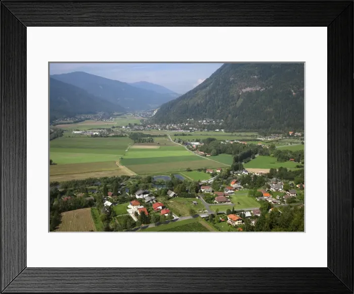 Framed Print : Villach, Carinthia, Austria - High angle view of a rural landscape with a residential area Framed Print : Villach, Carinthia, Austria - High angle view of a rural landscape with a residential area