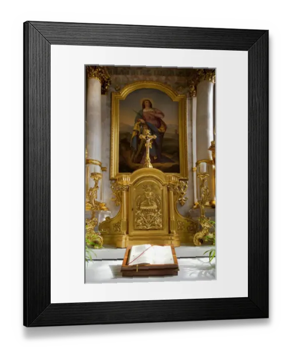 Framed Print : Wels, Upper Austria, Austria - An open bible is set in front of a gold iconic carving Framed Print : Wels, Upper Austria, Austria - An open bible is set in front of a gold iconic carving