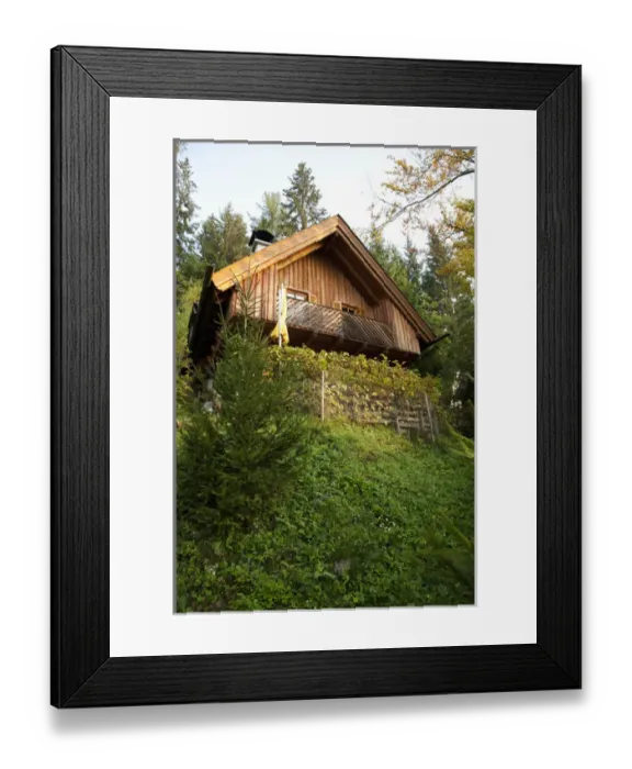 Framed Print : Villach, Carinthia, Austria - Low angle exterior view of cabin on a hill in the forest Framed Print : Villach, Carinthia, Austria - Low angle exterior view of cabin on a hill in the forest