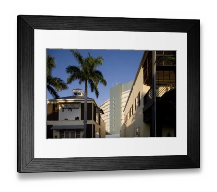 Framed Print : Bahamas, Grand Bahama Island, Freeport, Setting sun lights exterior and palm trees