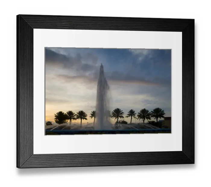 Framed Print : Bahamas, Grand Bahama Island, Freeport, Setting sun silhouettes fountains and palm Framed Print : Bahamas, Grand Bahama Island, Freeport, Setting sun silhouettes fountains and palm