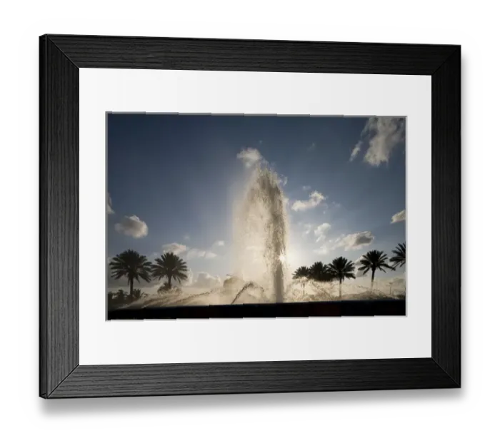 Framed Print : Bahamas, Grand Bahama Island, Freeport, Setting sun silhouettes fountains and palm Framed Print : Bahamas, Grand Bahama Island, Freeport, Setting sun silhouettes fountains and palm