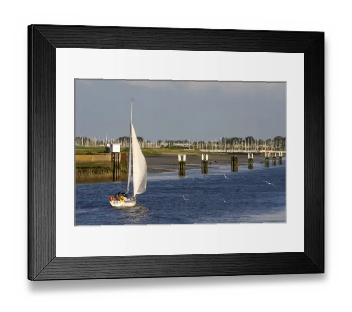 Framed Print : A sail boat at Nieuwpoort harbor entrance in the province of West Flanders, Belgium Framed Print : A sail boat at Nieuwpoort harbor entrance in the province of West Flanders, Belgium