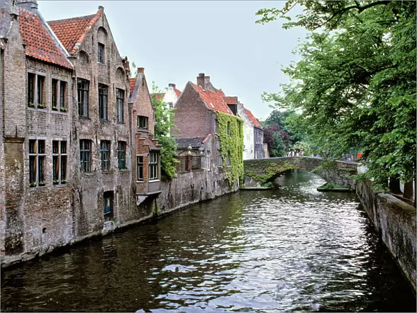 Europe, Belgium, Brugge. Old stone homes line the canals in Brugge, a World Heritage Site
