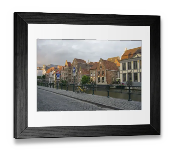 Framed Print : Europe, Belgium, Ghent. A bicycle parked on a paved-stone sidewalk by the water Framed Print : Europe, Belgium, Ghent. A bicycle parked on a paved-stone sidewalk by the water