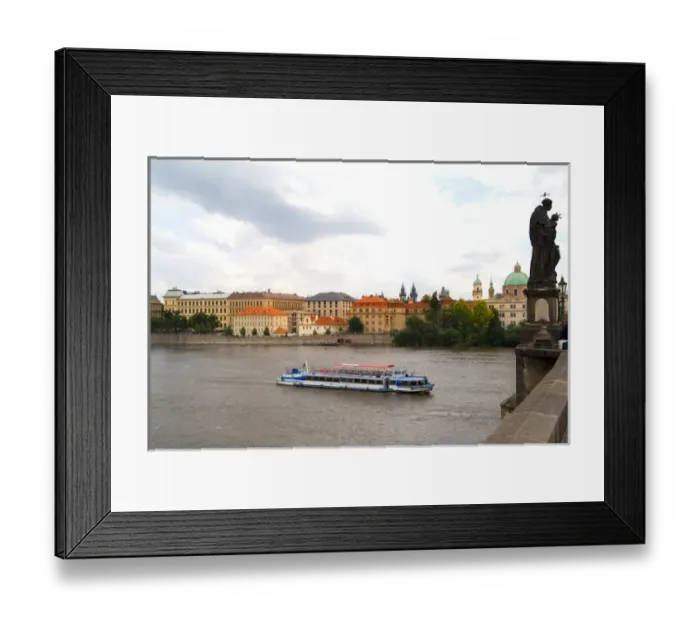Framed Print : River boat on Vitava River and the famous Charles Bridge of tourist city of Prague Framed Print : River boat on Vitava River and the famous Charles Bridge of tourist city of Prague
