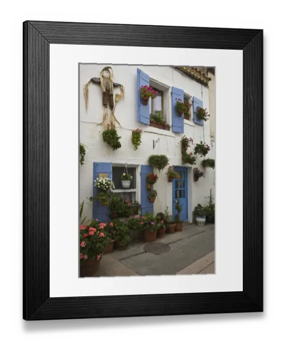 Framed Print : France, Camargue, Saintes-Maries-de-la-Mer. Colorful homes line the quaint streets