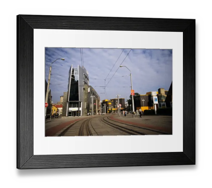 Framed Print : Liberec, Czech Republic. Modern town street with tram lines, McDonalds advertisement Framed Print : Liberec, Czech Republic. Modern town street with tram lines, McDonalds advertisement