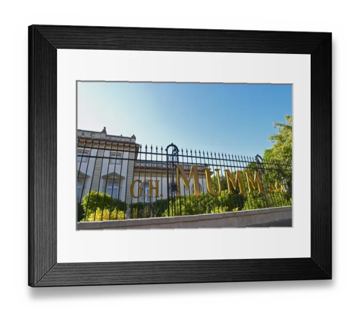 Framed Print : A wrought iron fence and golden letters in the setting sun at at Champagne G. H