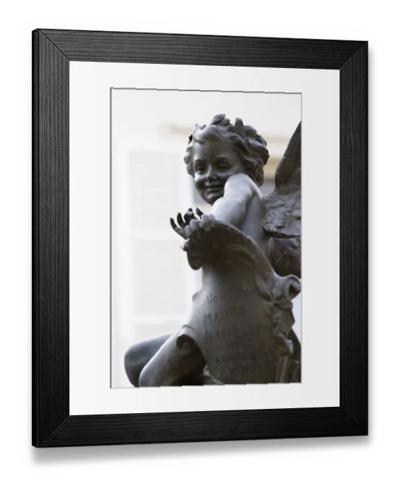 Framed Print : In the court yard at Champagne Deutz a statue of young Cupid It has given the name Framed Print : In the court yard at Champagne Deutz a statue of young Cupid It has given the name