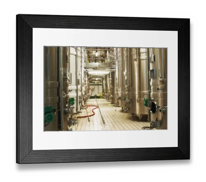 Framed Print : Rows of Stainless steel wine fermentation tanks with two tanks that are in cold stabilization Framed Print : Rows of Stainless steel wine fermentation tanks with two tanks that are in cold stabilization