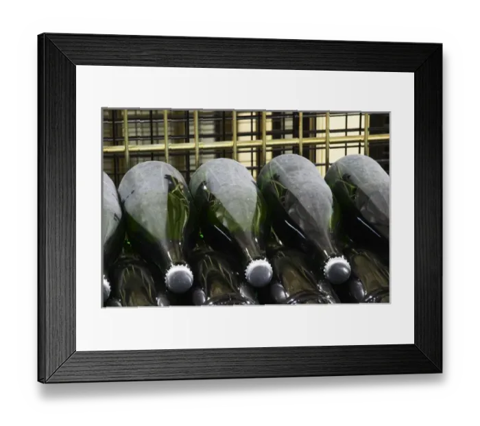 Framed Print : Wine Bottles of champagne resting horizontally on the side undergoing secondary fermentation Framed Print : Wine Bottles of champagne resting horizontally on the side undergoing secondary fermentation