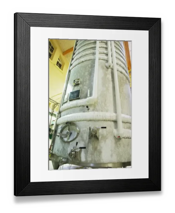 Framed Print : A stainless steel fermentation tank with still wine undergoing cold stabilization Framed Print : A stainless steel fermentation tank with still wine undergoing cold stabilization