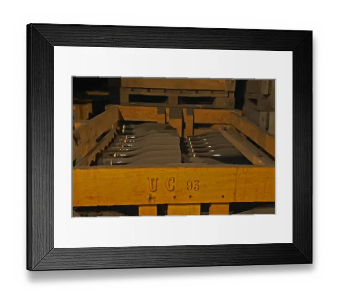 Framed Print : In the wine cellar: Dusty dust covered bottles lying in a wooden crate after Framed Print : In the wine cellar: Dusty dust covered bottles lying in a wooden crate after