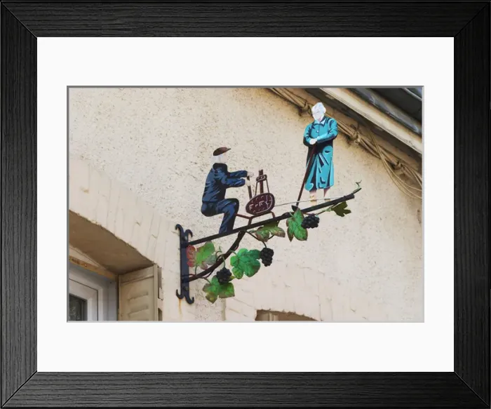 Framed Print : A wrouight iron painted sign that illustrates the theme of champagne and wine production Framed Print : A wrouight iron painted sign that illustrates the theme of champagne and wine production
