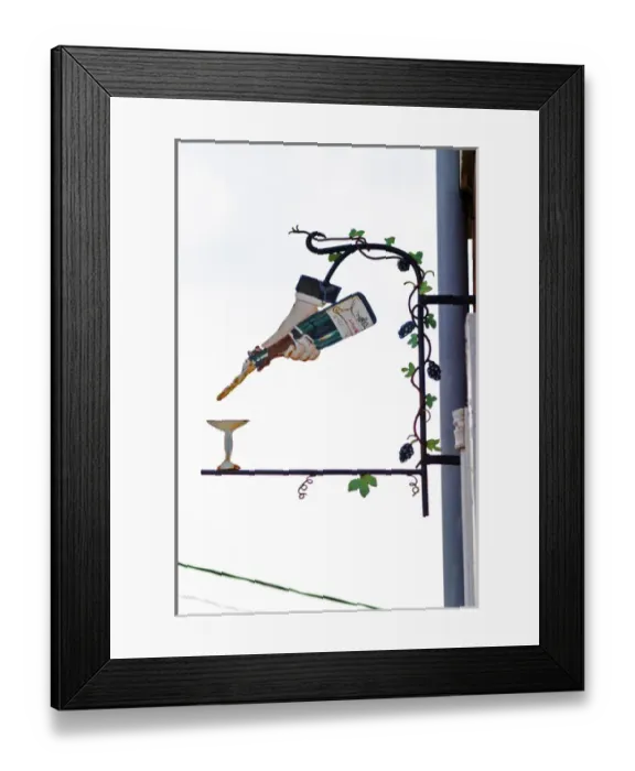 Framed Print : A wrouight iron painted sign that illustrates the theme of champagne and wine production Framed Print : A wrouight iron painted sign that illustrates the theme of champagne and wine production