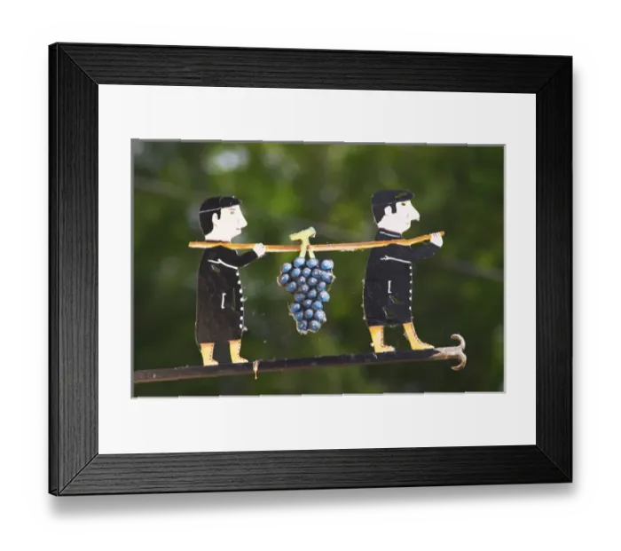Framed Print : A wrought iron painted sign that illustrates the theme of champagne and wine production