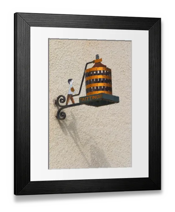 Framed Print : A wrouight iron painted sign that illustrates the theme of champagne and wine production Framed Print : A wrouight iron painted sign that illustrates the theme of champagne and wine production
