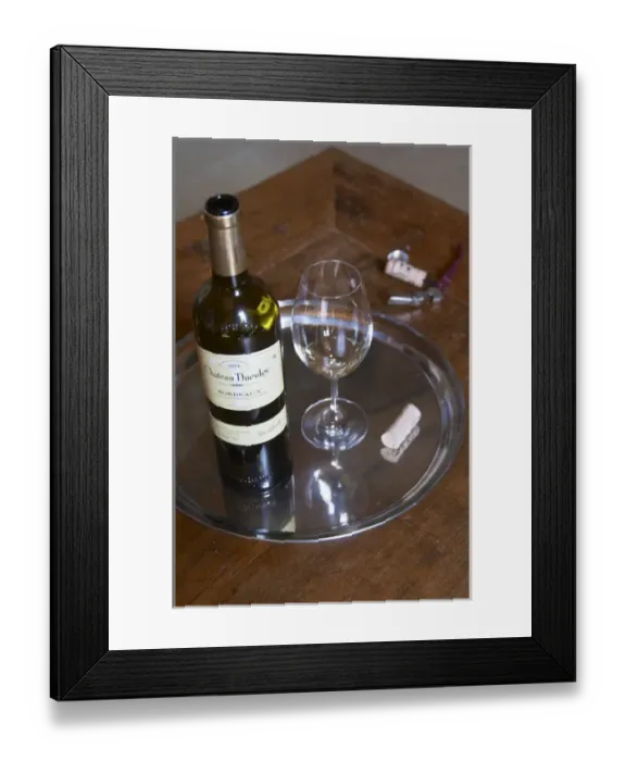 Framed Print : A glass of white vintage 2004 with the bottle and the cork and corkscrew, Chateau