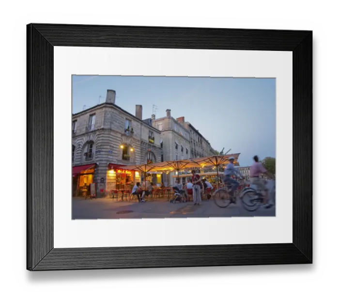 Framed Print : A cafe on the place pey berland in Bordeaux, outside seating terrasse lit by electric lights
