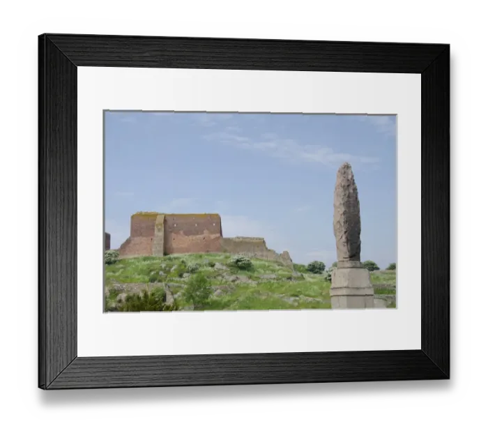 Framed Print : Denmark, Island of Bornholm. Stone monument in front of ruins of Hammershus Castle