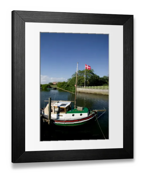 Framed Print : Boat tied up at wharf on Ribe River, Ribe, Jutland, Denmark Framed Print : Boat tied up at wharf on Ribe River, Ribe, Jutland, Denmark