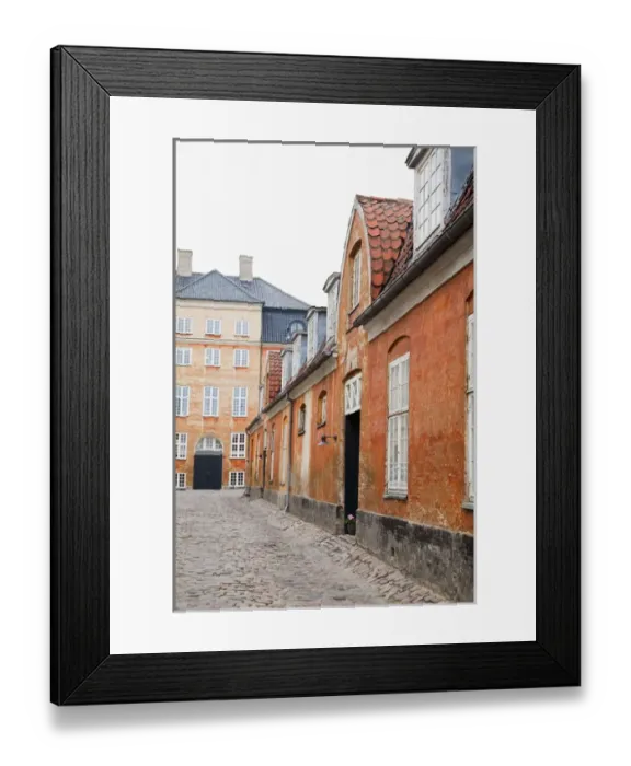 Framed Print : Copenhagen, Denmark - An image of an old world, cobblestone street and surrounding buildings Framed Print : Copenhagen, Denmark - An image of an old world, cobblestone street and surrounding buildings