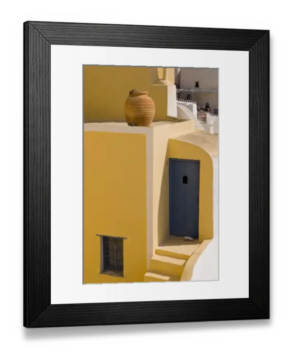 Framed Print : The beautiful colorful buildings on the mountain cliffs of the small isolated romantic city of Oia Framed Print : The beautiful colorful buildings on the mountain cliffs of the small isolated romantic city of Oia