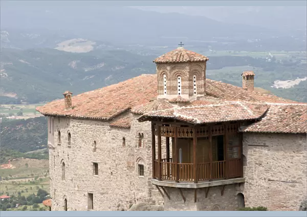 Europe, Greece, Meteora. Overview of Saint Barbara Roussanou Monastery and wood balcony