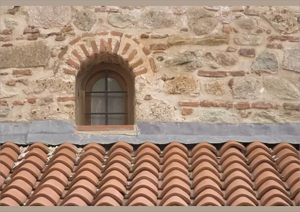 Europe, Greece, Meteora. Tile roof and small window in Grand Meteora Monastery. Credit as