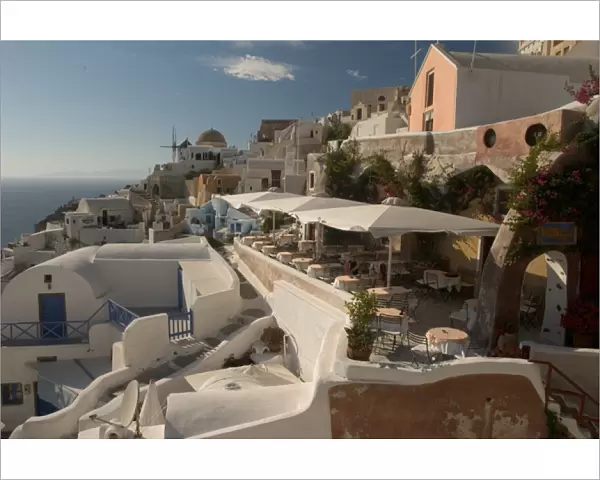 Europe, Greece, Cyclades, Santorini: Oia restaurant with view of the sunset