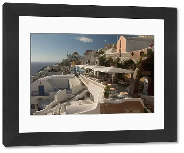 Europe, Greece, Cyclades, Santorini: Oia restaurant with view of the sunset