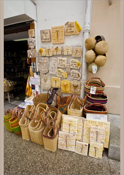 France, Provence, St. Remy-de-Provence. Wares on display outside souvenir shop. Credit as