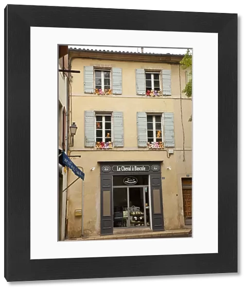 France, Provence, St. Remy-de-Provence. Colorful teddy bears on outside ledges of shop windows