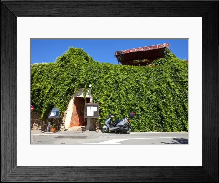 Framed Print : France, Provence, Roussillon. Motorcycle outside restaurant entrance. Credit as