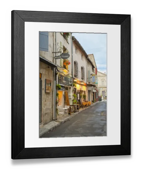 Framed Print : France, Provence, St. Remy-de-Provence. Shops and restaurants line the street. Credit as Framed Print : France, Provence, St. Remy-de-Provence. Shops and restaurants line the street. Credit as