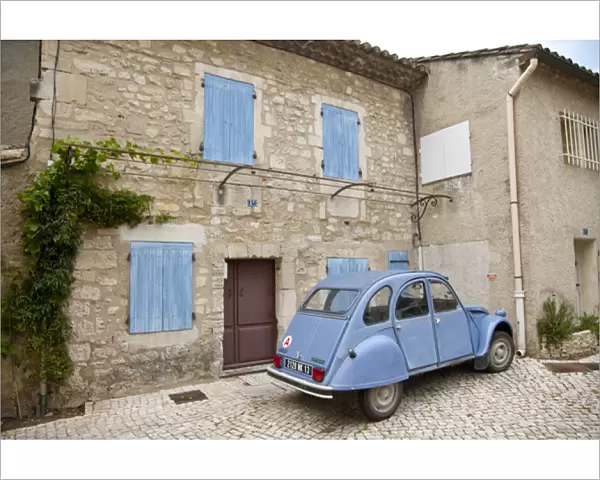 France, Provence, St. Remy-de-Provence. Classic Citroen car sits outside building