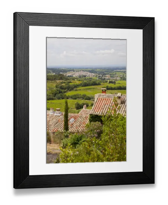 Framed Print : France, Provence, Seguret. View of countryside above tiled rooftops. Credit as: Fred