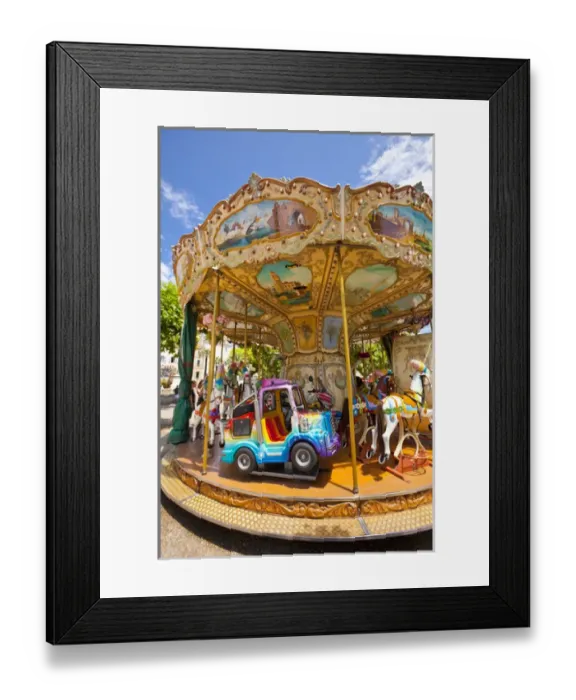 Framed Print : France, Provence, Cannes. Colorful and ornate outdoor carousel. Credit as: Fred Lord