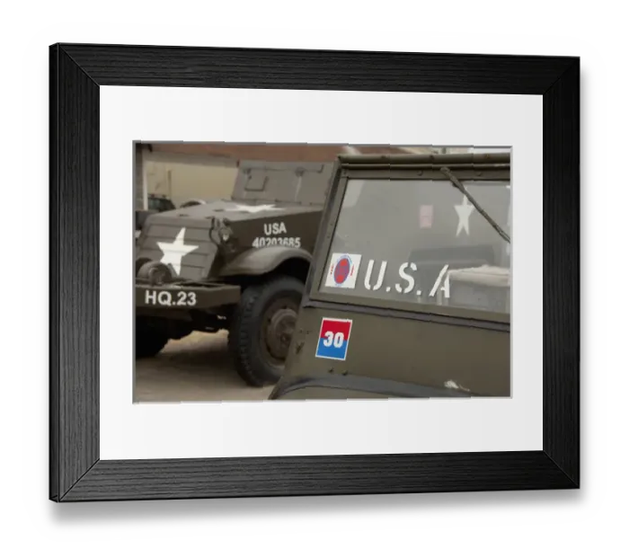 Framed Print : France, Normandy, Arromanches. 66th Anniversary of D-Day. Vintage American jeeps