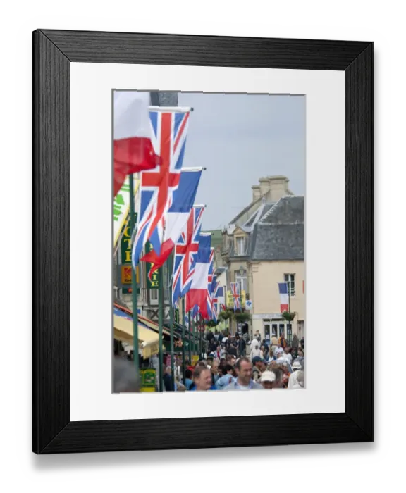 Framed Print : France, Normandy, Arromanches. Ceremonial flags line the streets of Normandy for Framed Print : France, Normandy, Arromanches. Ceremonial flags line the streets of Normandy for