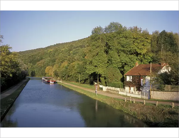 Europe, France, Cote d Or Burgundy canal with tourist barge