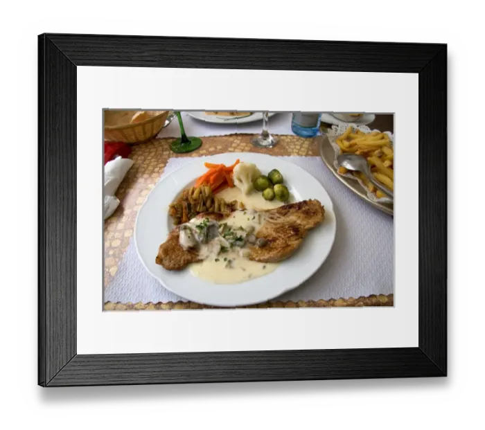 Framed Print : Veal with a cream sauce served at a sidewalk restaurant in Ribeauville, France
