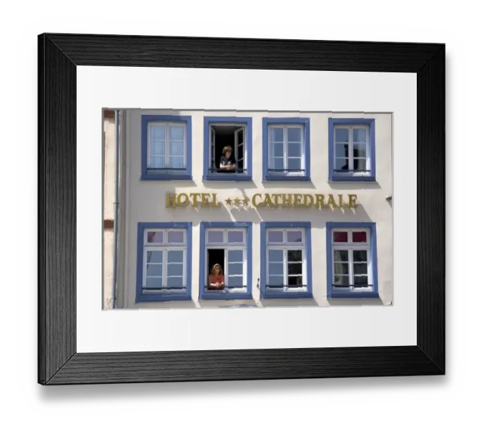 Framed Print : Women looking out the window of the Cathedral Hotel at Strasbourg, France Framed Print : Women looking out the window of the Cathedral Hotel at Strasbourg, France