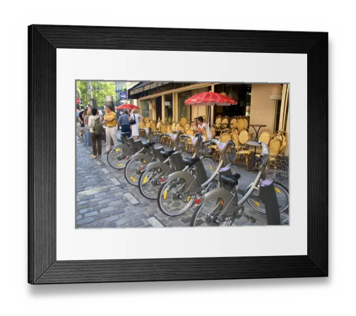 Framed Print : A rack of rental bicycles are part of the Velib, a bike transit system in Paris, France Framed Print : A rack of rental bicycles are part of the Velib, a bike transit system in Paris, France