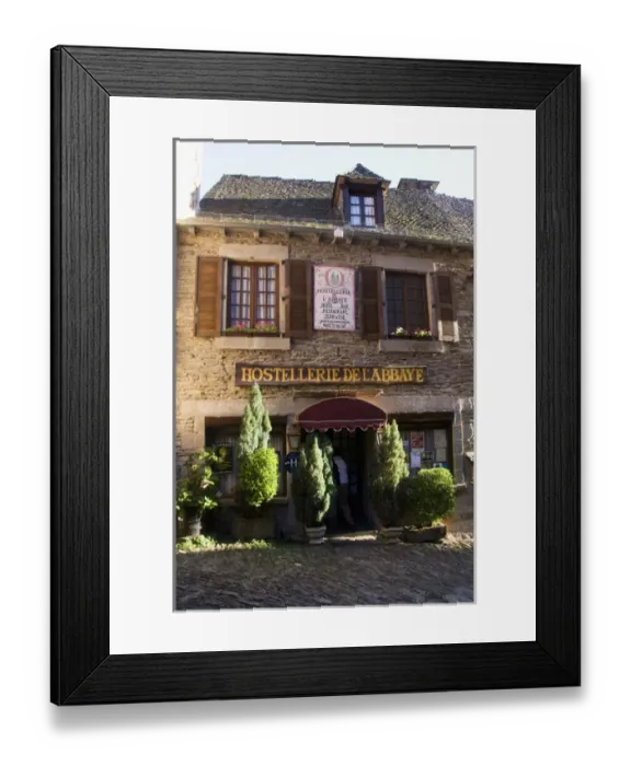 Framed Print : FRANCE, Midi-Pyrenees, Department of Aeyron, Rodez. Romanesque-styled hotel in Conques