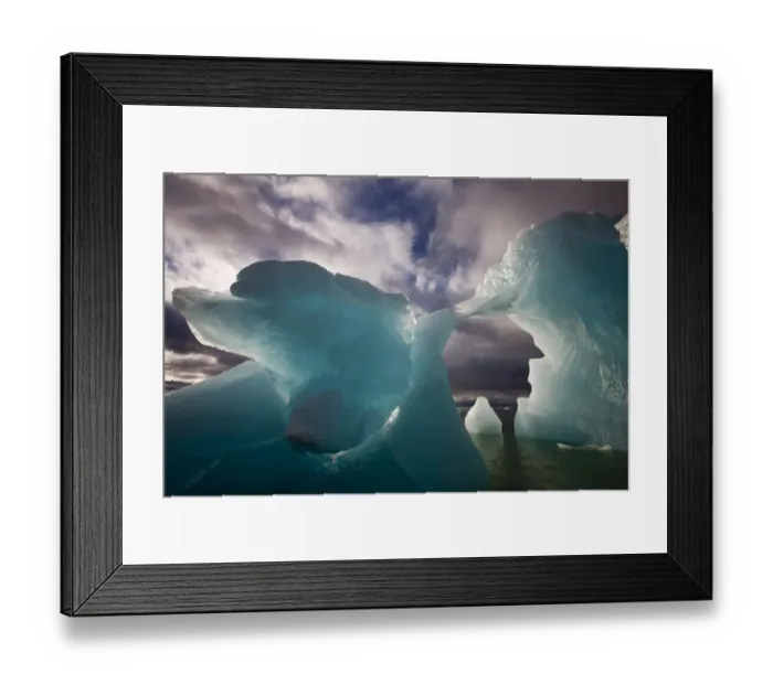 Framed Print : Norway, Svalbard, Spitsbergen Island, Morning sun lights melting arched iceberg floating