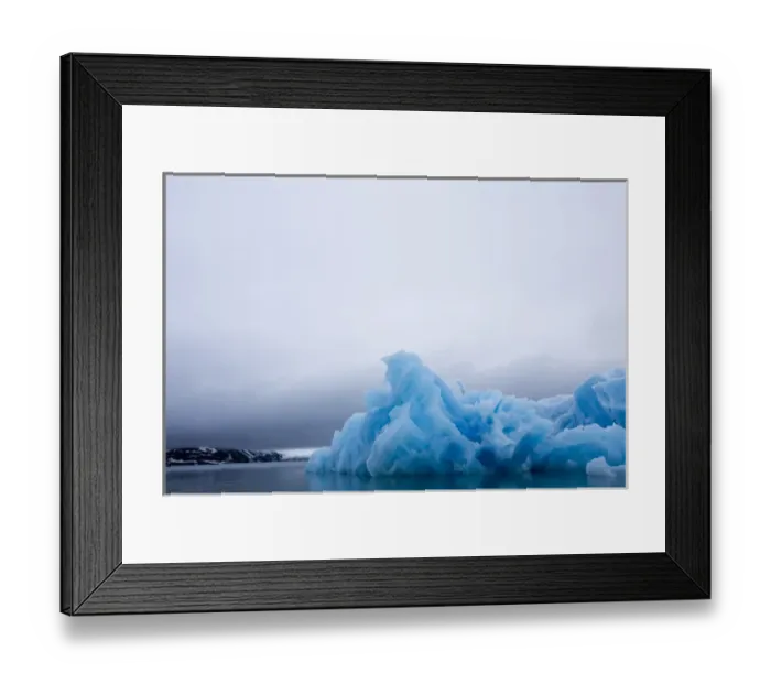 Framed Print : Norway, Svalbard, Spitsbergen Island, Summer snow storm above deep blue glacial iceberg Framed Print : Norway, Svalbard, Spitsbergen Island, Summer snow storm above deep blue glacial iceberg