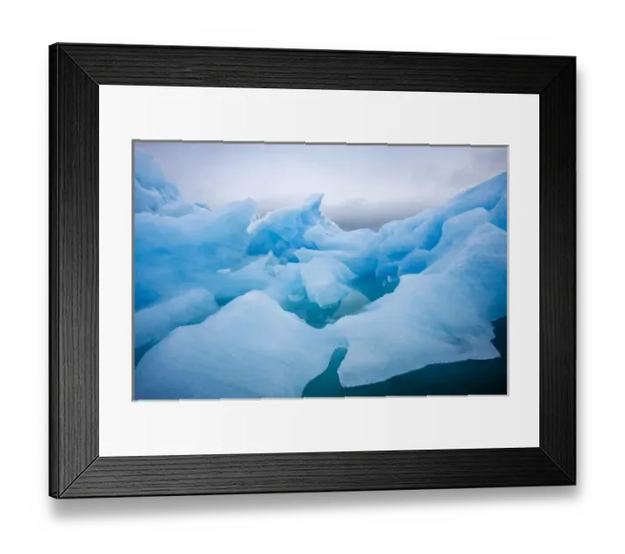 Framed Print : Norway, Svalbard, Spitsbergen Island, Summer snow storm above deep blue glacial iceberg Framed Print : Norway, Svalbard, Spitsbergen Island, Summer snow storm above deep blue glacial iceberg